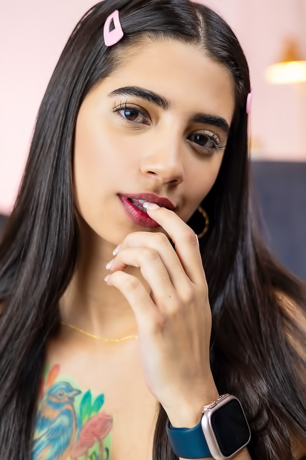 Tormenta poses in pink lingerie teasing with her toy in a bedroom solo session showing off her tattoos