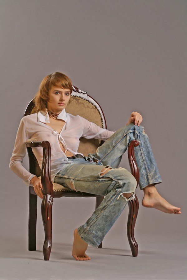 Ginger teen strips off on armchair