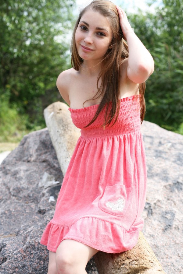Frisky babe poses naked