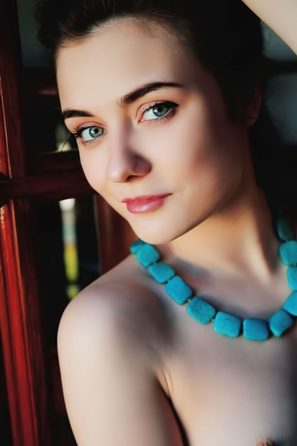 Brunette admires the beauty of her body