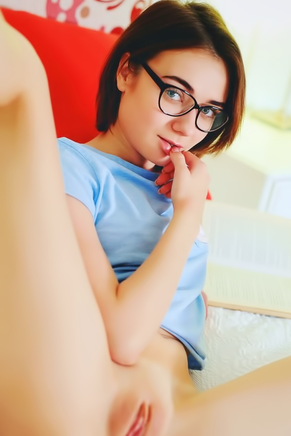 Naughty babe reads books and masturbates at once