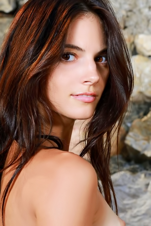 Perfect brunette relaxes naked on a hot summer day