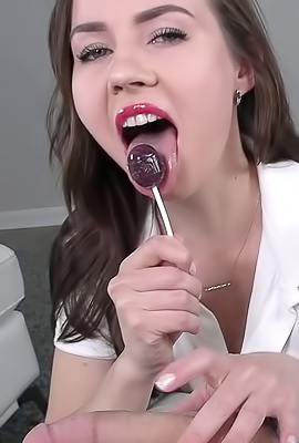 Lana Blade swirls candy into your mouth while edging your balls with a teasing handjob